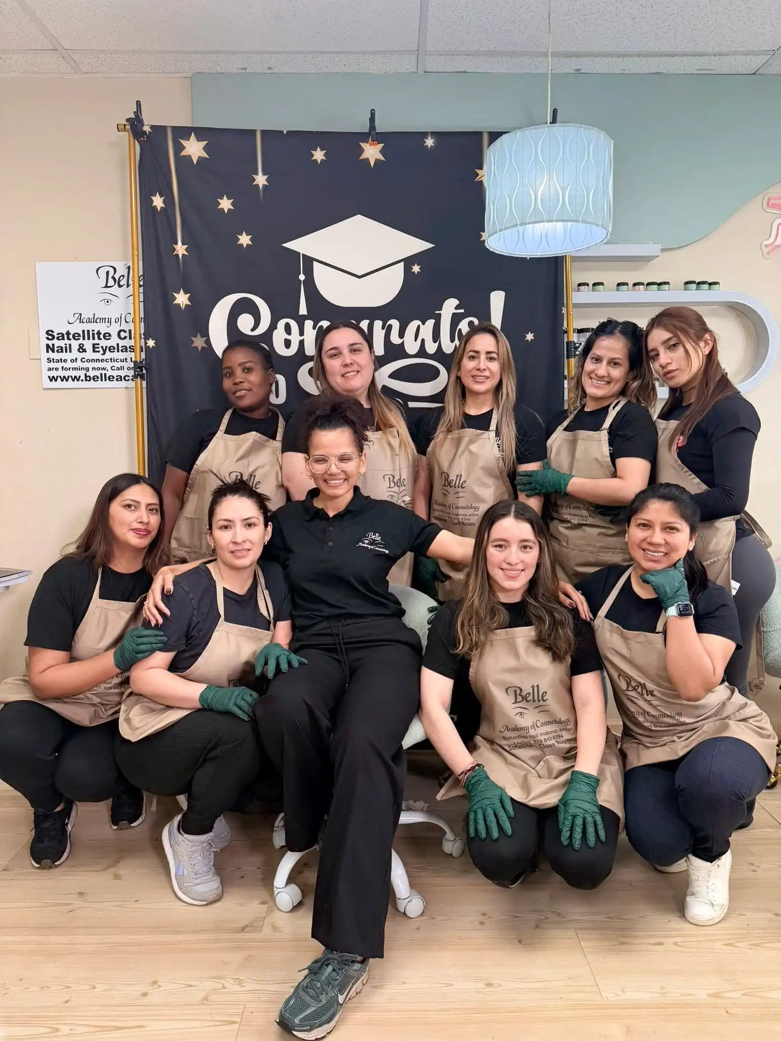 Belle Academy beauty school class smiling group photo